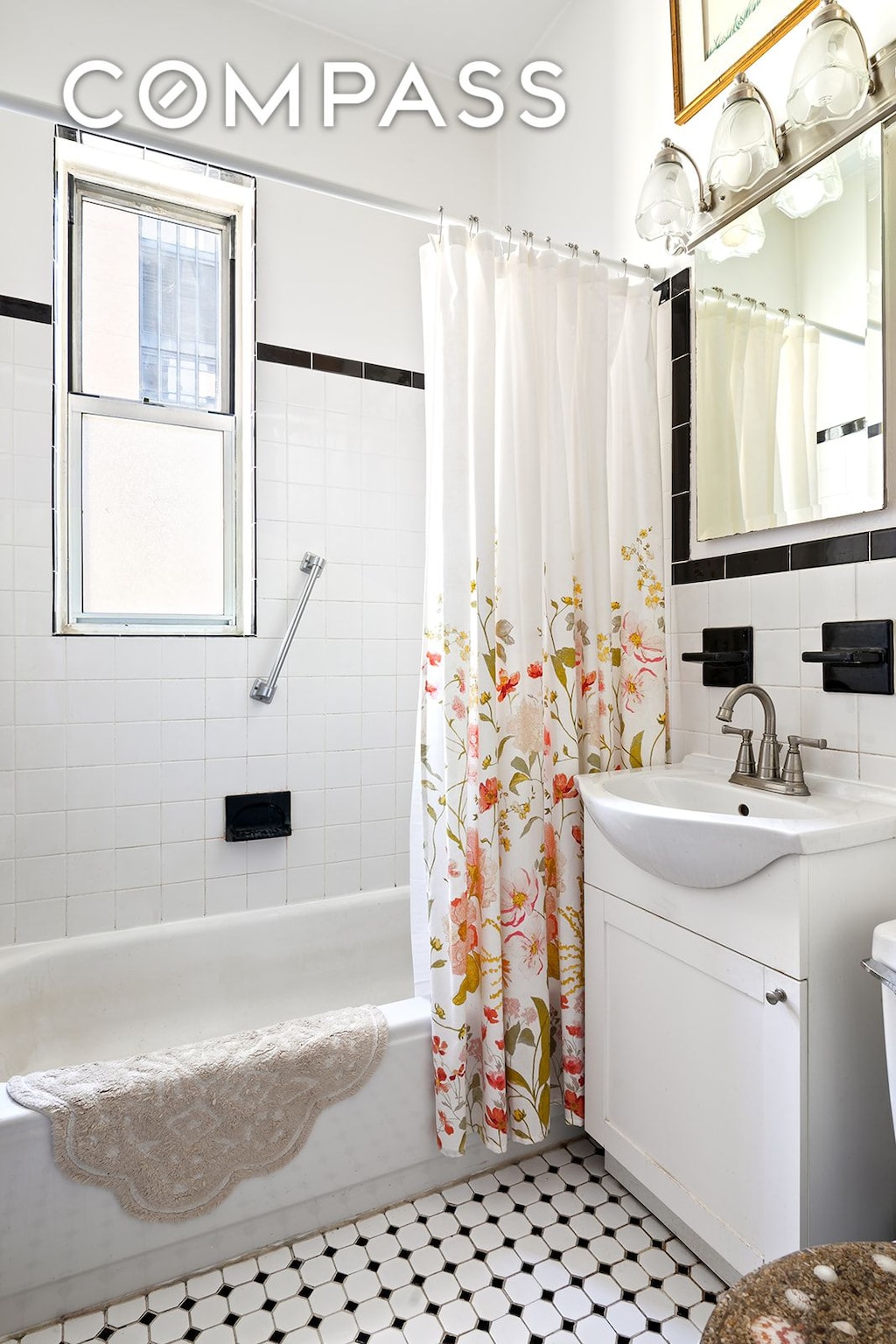 full bathroom featuring shower / bath combo with shower curtain, vanity, and decorative backsplash