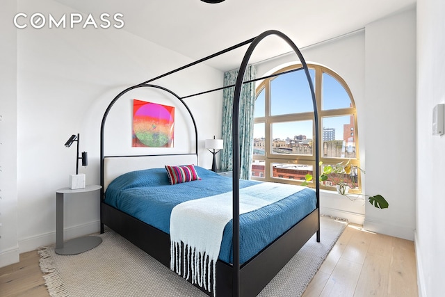 229 9th St Unit 601, New York City, NY 11215 - bedroom featuring wood finished floors and a city view