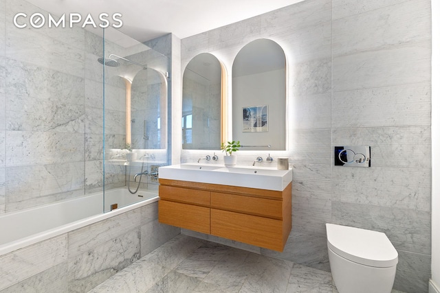 229 9th St Unit 601, New York City, NY 11215 - bathroom with double vanity, tiled shower / bath, and tile walls