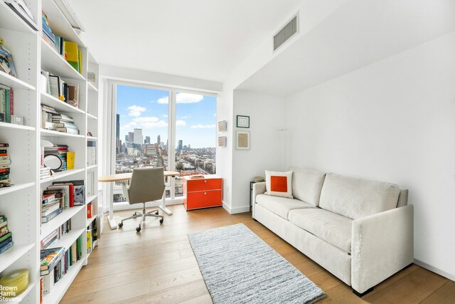 50 Bridge Park Dr Unit 21D, New York City, NY 11201 - office area with a view of skyline and wood finished floors