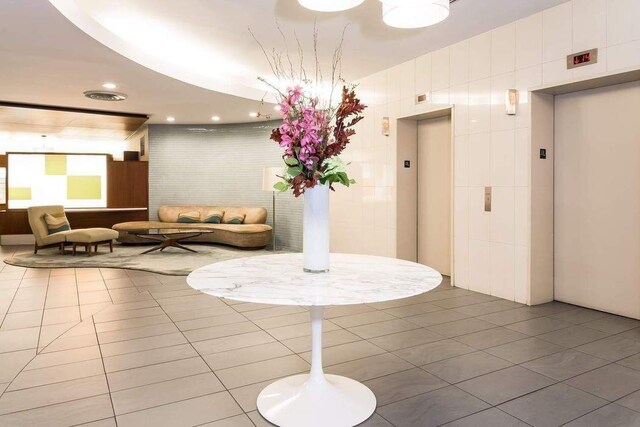 310 E 46th St Unit 19M, New York City, NY 10017 - lobby with tile walls
