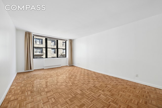 empty room featuring baseboards