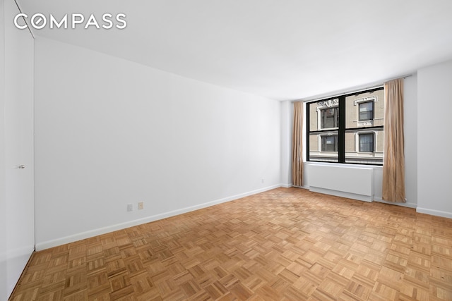 empty room featuring baseboards