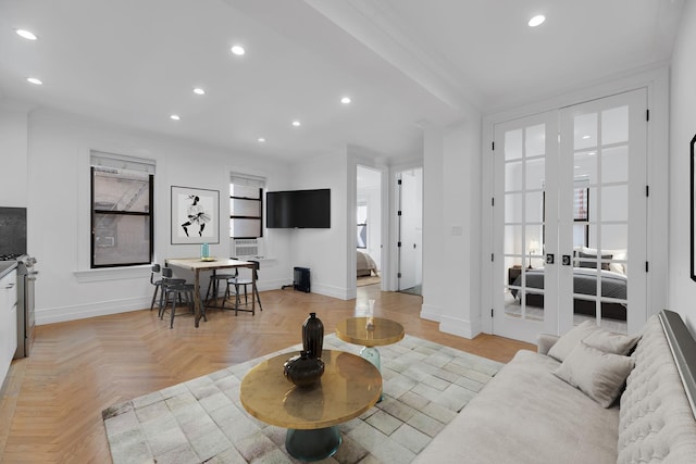 living area with baseboards, recessed lighting, and plenty of natural light