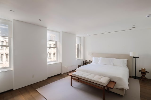 38-40 E 76th St, New York City, NY 10021 - bedroom with wood finished floors and radiator heating unit
