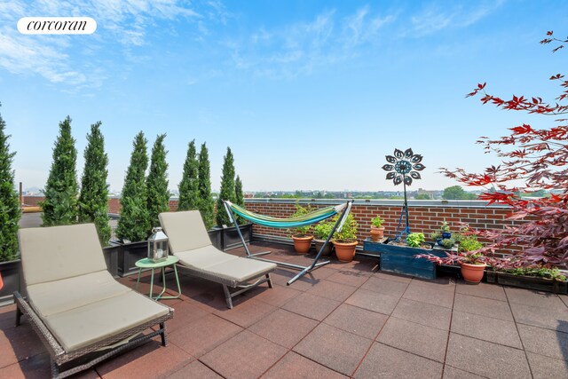 view of patio / terrace with a balcony