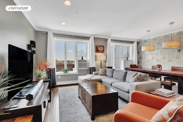 living room with light wood-style flooring, visible vents, baseboards, and ornamental molding