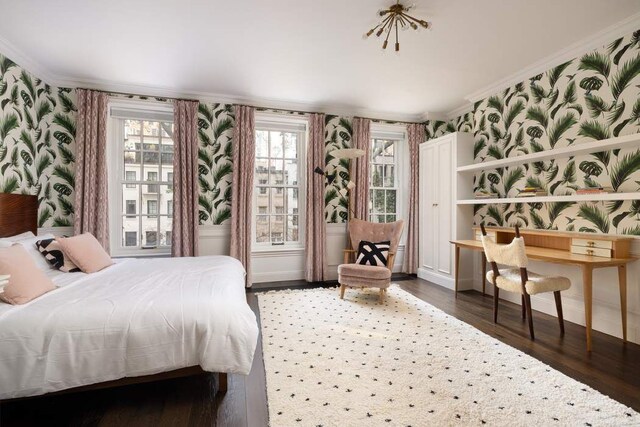 241 E 48th St, New York City, NY 10017 - bedroom with wallpapered walls, wood finished floors, baseboards, and ornamental molding