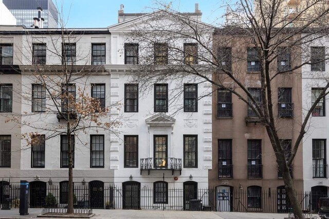 241 E 48th St, New York City, NY 10017 - view of building exterior featuring a fenced front yard