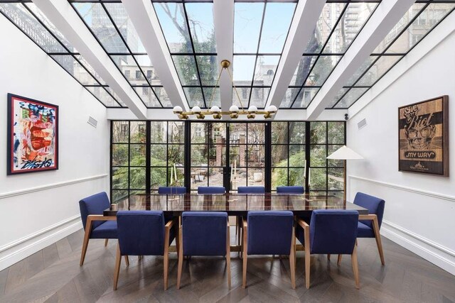 241 E 48th St, New York City, NY 10017 - sunroom / solarium featuring plenty of natural light and an inviting chandelier