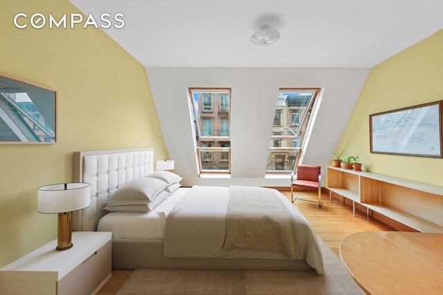 bedroom with light wood finished floors