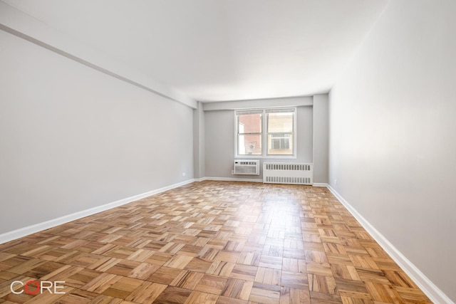 37-31 73rd St Unit 3P, New York City, NY 11372 - spare room featuring radiator heating unit and a wall mounted air conditioner