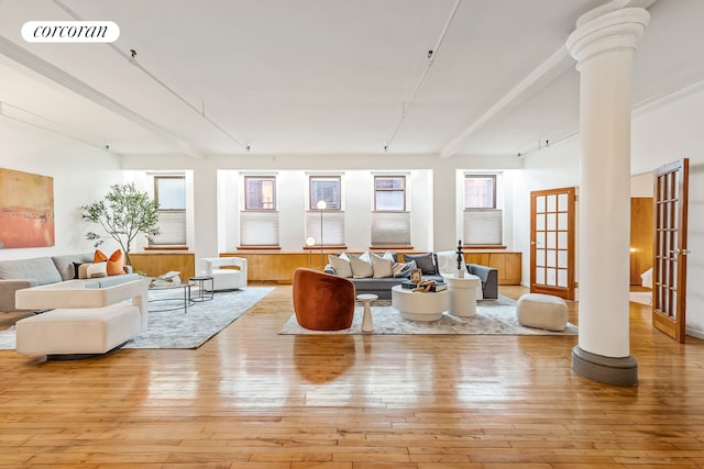 40 W 24th St Unit 6West, New York City, NY 10010 - living area with decorative columns and wood-type flooring