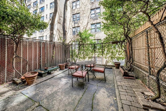 315 W 71st St, New York City, NY 10023 - fenced backyard featuring outdoor dining space and a patio