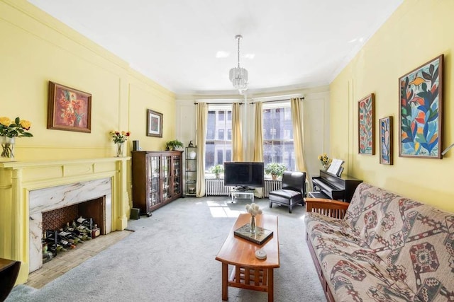 315 W 71st St, New York City, NY 10023 - carpeted living area with ornamental molding, a high end fireplace, and radiator