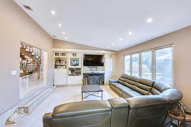 living area featuring light tile patterned floors, visible vents, recessed lighting, stairway, and lofted ceiling