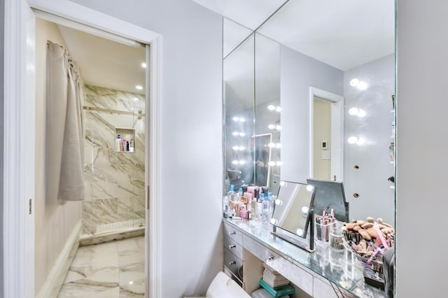 bathroom with a shower stall, marble finish floor, and baseboards
