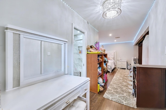 interior space featuring a chandelier, recessed lighting, and wood finished floors