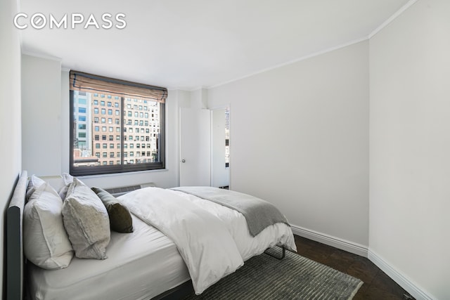 bedroom featuring baseboards and ornamental molding
