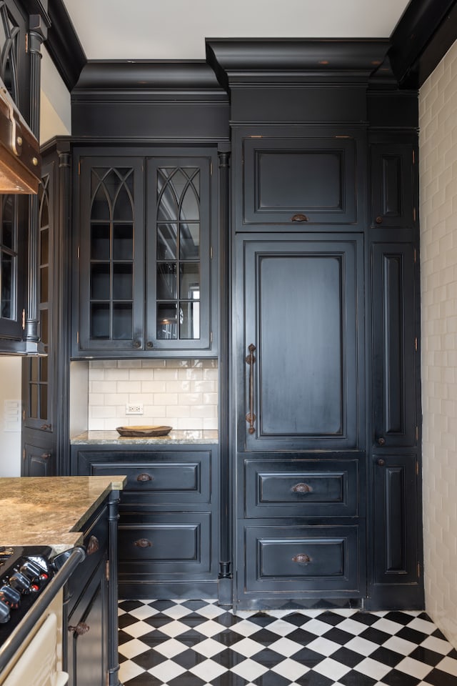 bar with tile patterned floors, tasteful backsplash, and crown molding