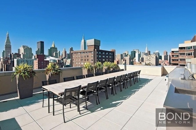 300 E 23rd St Unit 7H, New York City, NY 10010 - view of patio featuring a view of skyline and outdoor dining area