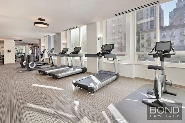 300 E 23rd St Unit 7H, New York City, NY 10010 - gym with carpet floors and baseboards
