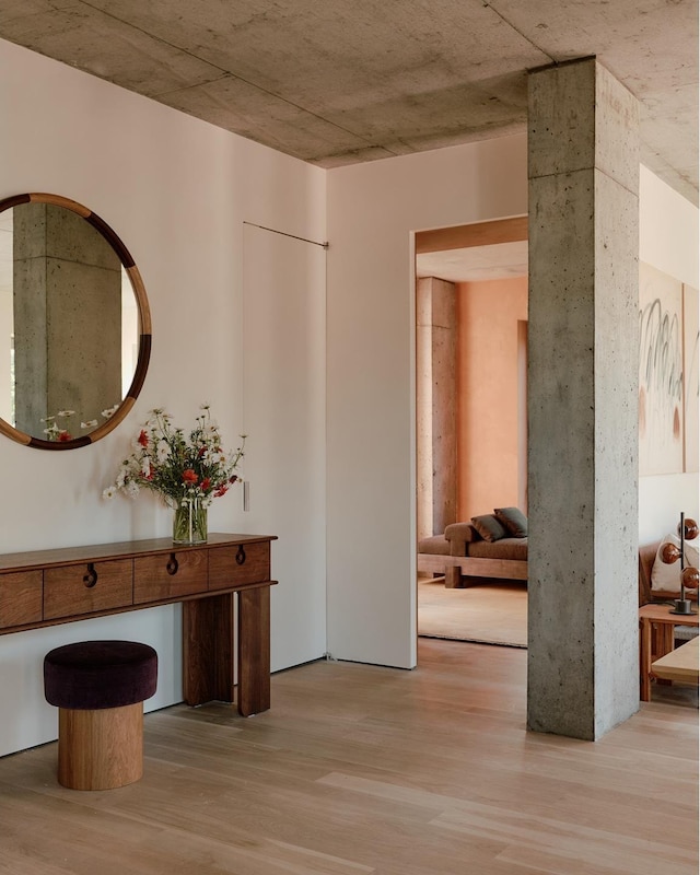 corridor featuring wood finished floors