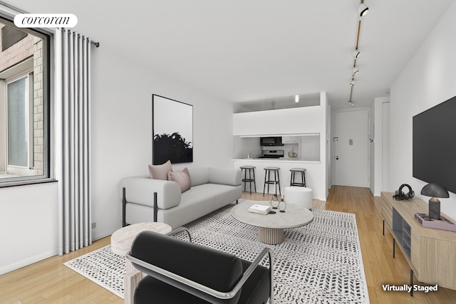 living area with light wood-style floors