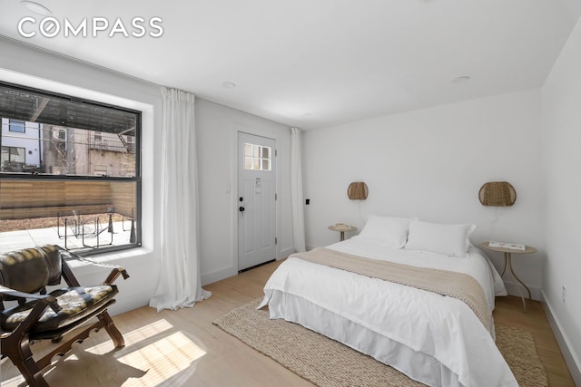 bedroom with wood finished floors