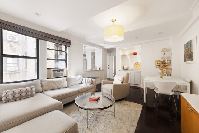 74 W 68th St Unit 6C, New York City, NY 10023 - living area featuring hardwood / wood-style flooring, cooling unit, and ornamental molding