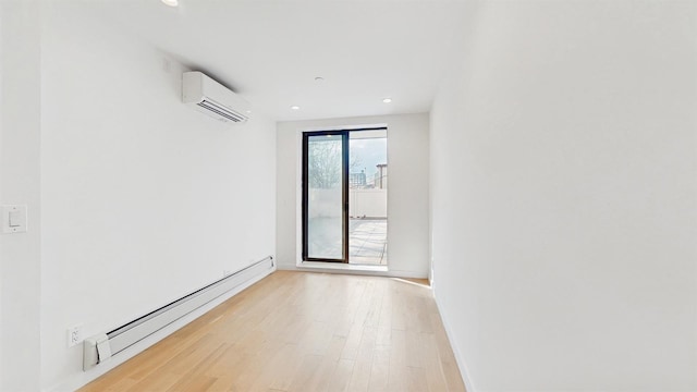 800 5th Ave Unit 1A, New York City, NY 11232 - unfurnished room featuring a baseboard heating unit, a wall mounted AC, light wood-style flooring, recessed lighting, and baseboards