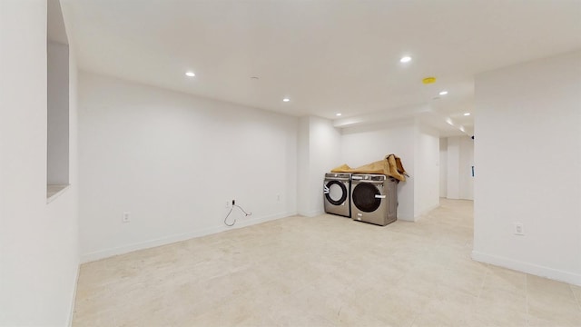 laundry area with laundry area, recessed lighting, baseboards, and washer and clothes dryer