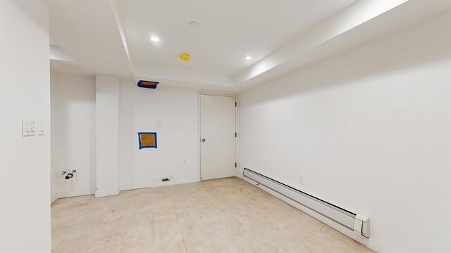 800 5th Ave Unit 1A, New York City, NY 11232 - empty room featuring baseboard heating, recessed lighting, and a raised ceiling