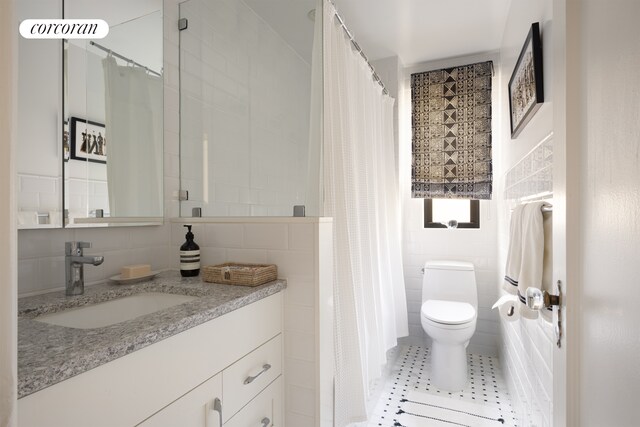 155 E 93rd St Unit 11G, New York City, NY 10128 - bathroom with tile walls, vanity, and curtained shower