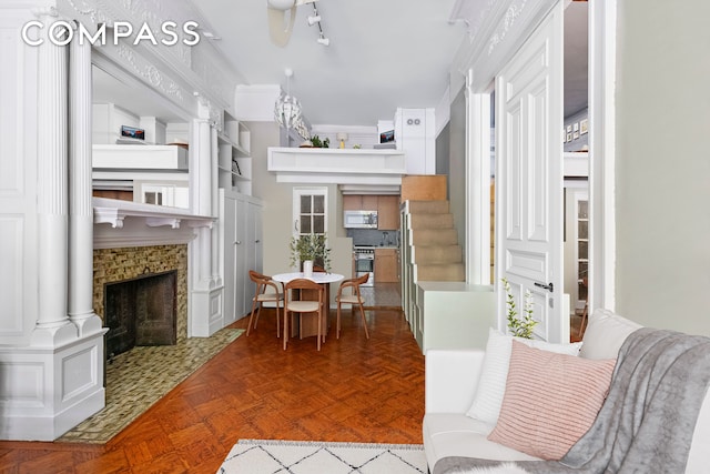 dining room with a tile fireplace