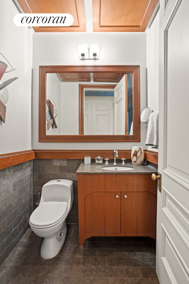 half bathroom featuring toilet and vanity
