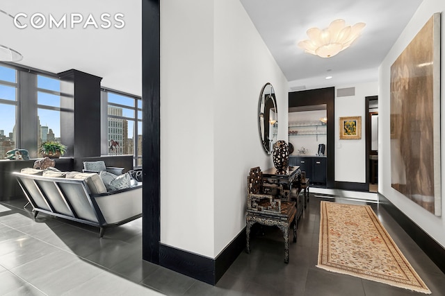 450 E 83rd St Unit Ph1B, New York City, NY 10028 - hall with a city view, baseboards, and visible vents