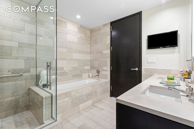 450 E 83rd St Unit Ph1B, New York City, NY 10028 - bathroom with a bath, a sink, double vanity, a stall shower, and recessed lighting