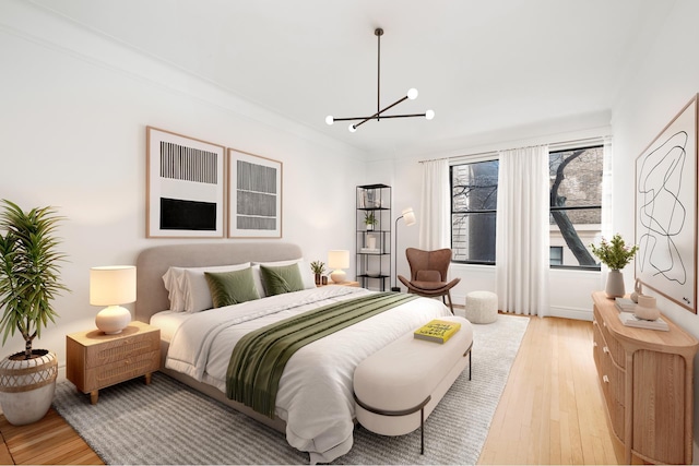 790 Riverside Dr Unit 1P, New York City, NY 10032 - bedroom featuring light wood-style flooring and a chandelier