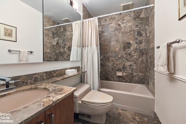 112 E 83rd St Unit 1B, New York City, NY 10028 - full bathroom featuring vanity, shower / bath combo with shower curtain, and stone finish floors