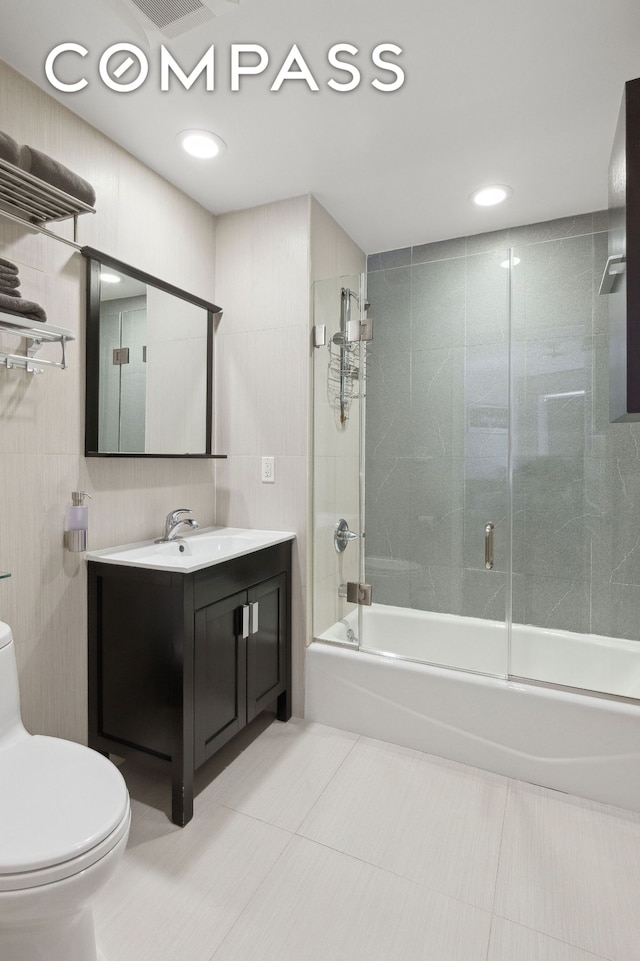 456 W 167th St Unit 7C, New York City, NY 10032 - full bathroom with toilet, tile patterned floors, vanity, shower / bath combination with glass door, and recessed lighting