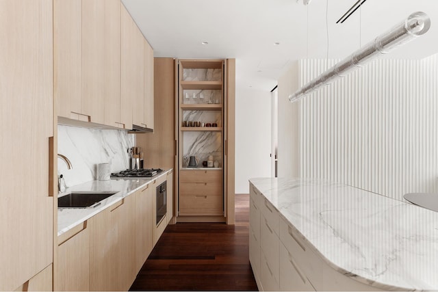 165 Charles St Unit 6, New York City, NY 10014 - kitchen with dark wood-type flooring, light brown cabinets, modern cabinets, and a sink
