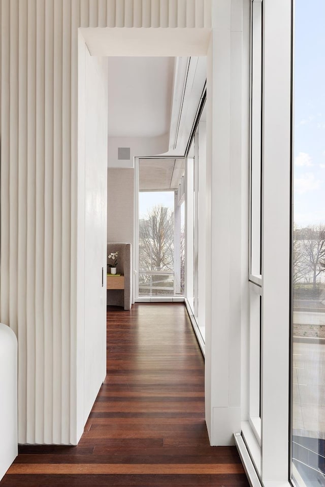 165 Charles St Unit 6, New York City, NY 10014 - hallway featuring a wealth of natural light, visible vents, and dark wood finished floors