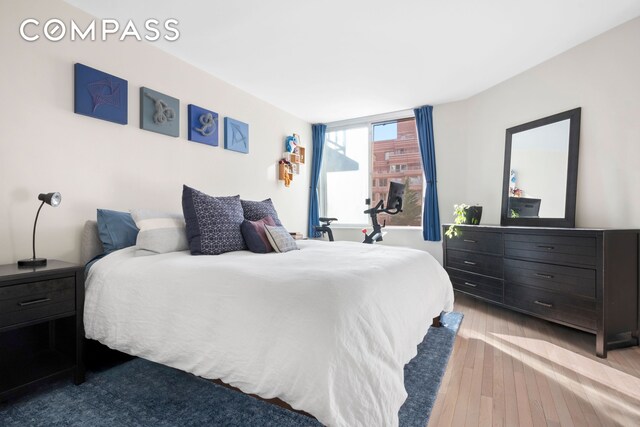 350 W 50th St Unit 3Ll, New York City, NY 10019 - bedroom featuring wood-type flooring