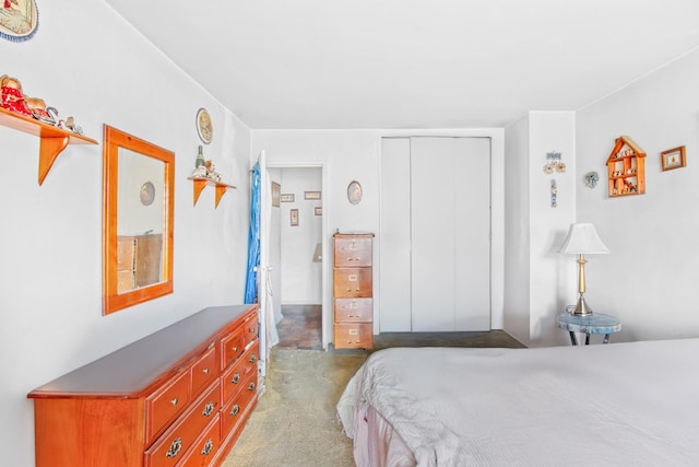 bedroom with a closet and light carpet