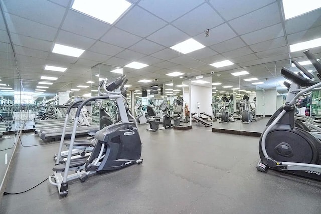 workout area featuring a drop ceiling