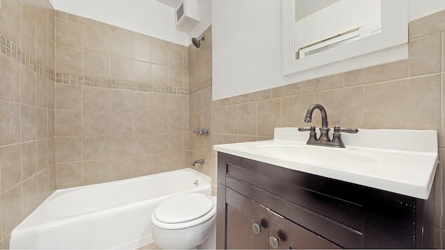 2 Tudor City Pl Unit Gns, New York City, NY 10017 - full bathroom with tile walls, vanity, bathtub / shower combination, and toilet