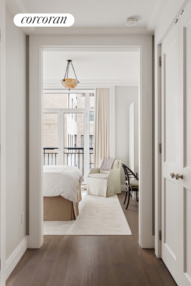 40 E 72nd St Unit 5, New York City, NY 10021 - bedroom featuring dark wood finished floors, crown molding, and baseboards