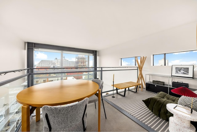 sunroom featuring a city view