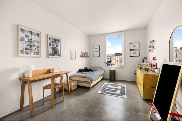 bedroom with finished concrete flooring